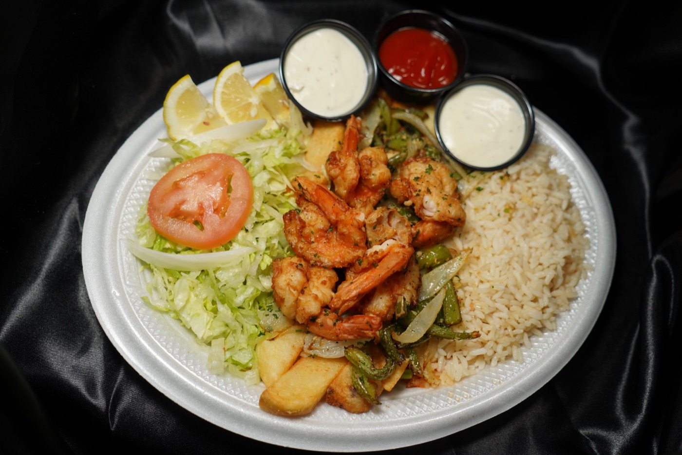 Shrimp with garlic sauce, rice, and salad